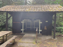 Exterior view of the Adirondack Cabins at the Fiber Arts Retreat showing the bunk beds