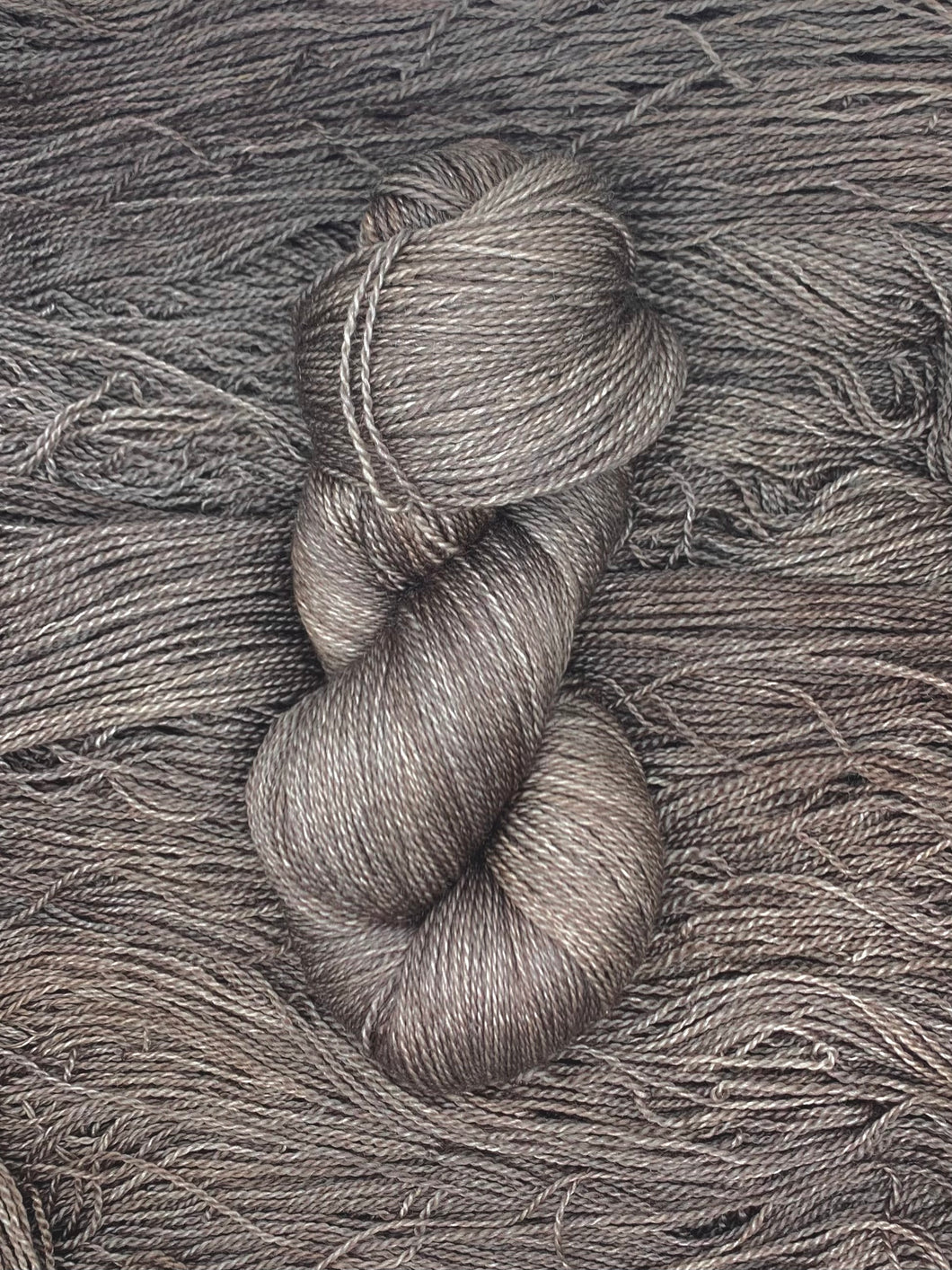 Hand dyed Superwash Merino cashmere and silk lace yarn in grayish brown