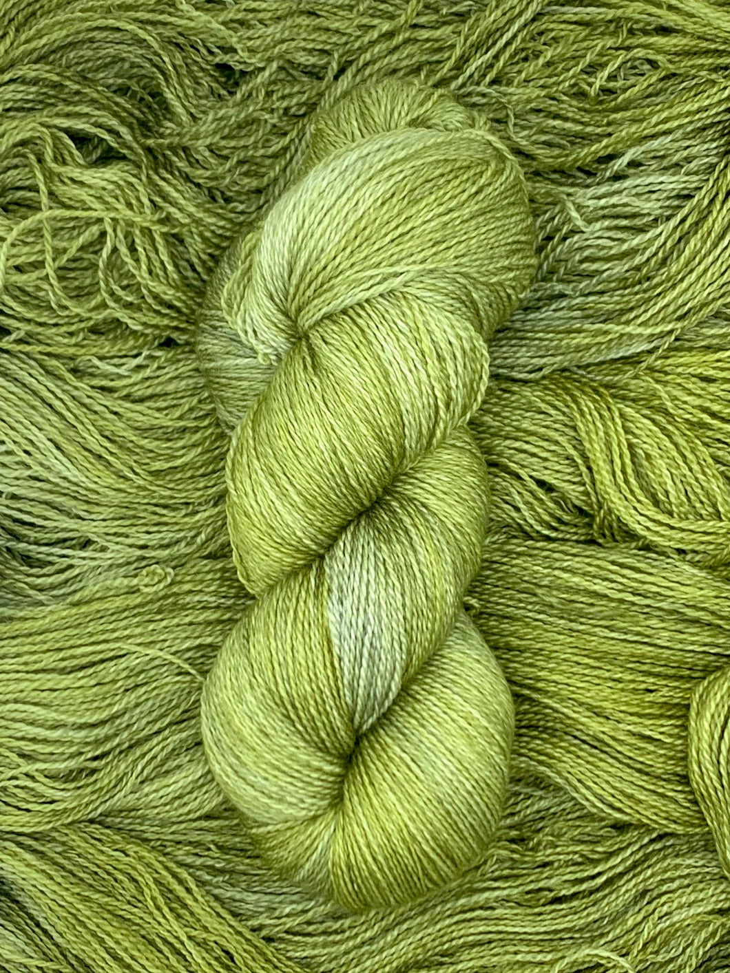 Hand dyed Superwash Merino cashmere and silk lace yarn in vibrant green yellow chartreuse 