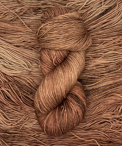 Hand Dyed Fingering Weight Superwash Merino cashmere nylon yarn in reddish brown
