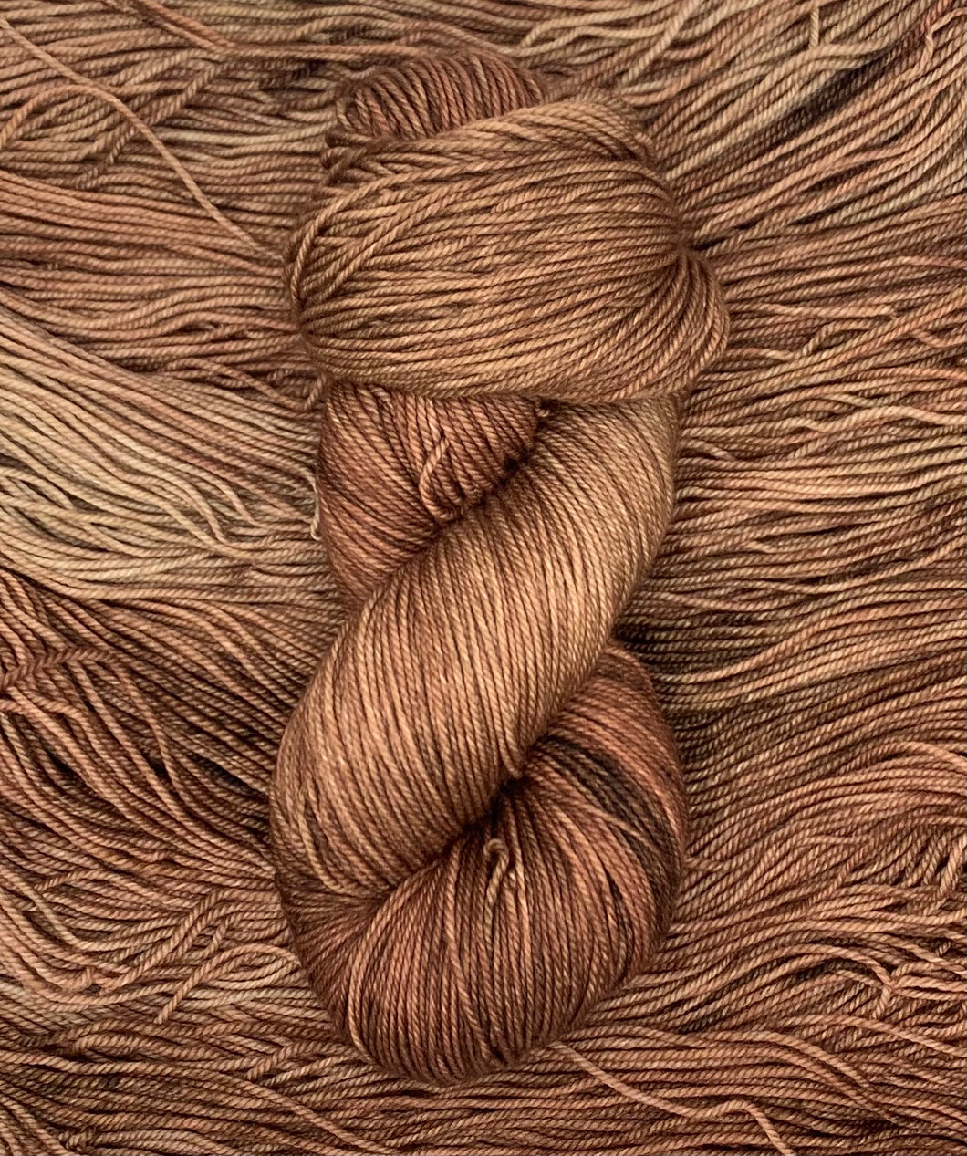 Hand Dyed Fingering Weight Superwash Merino cashmere nylon yarn in reddish brown