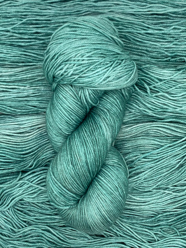 Hand Dyed Fingering Weight Superwash Merino cashmere nylon yarn in green blue teal