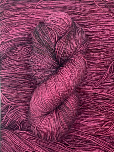 Hand Dyed Fingering Weight Superwash Merino cashmere nylon yarn in deep maroon purple plum
