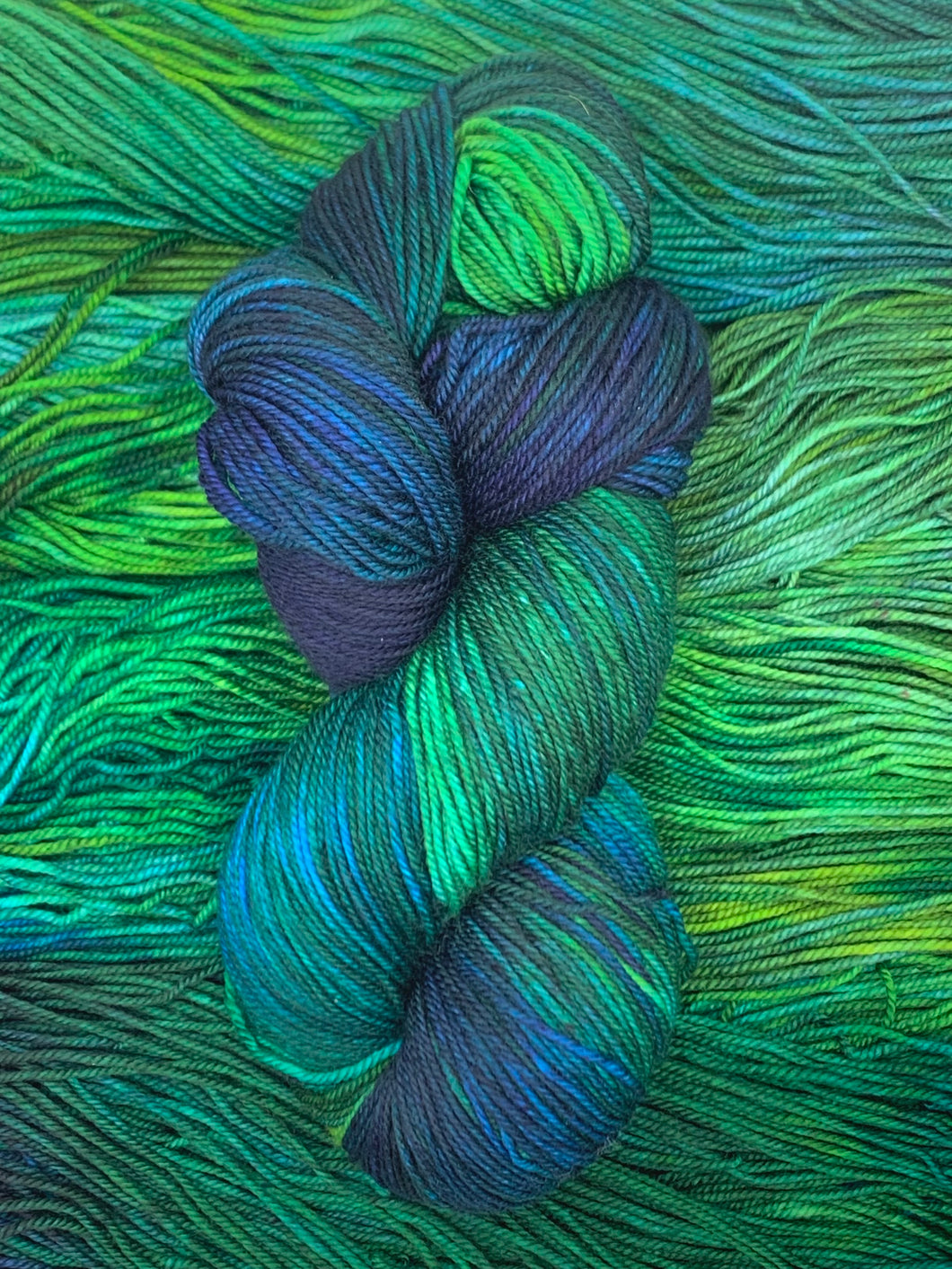Hand Dyed Fingering Weight Superwash Merino cashmere nylon yarn in blue green and purple