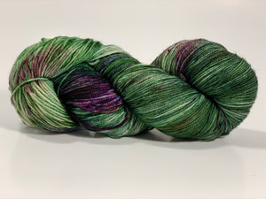 Hand Dyed Fingering Weight Superwash Merino cashmere nylon yarn in purples and greens