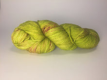 Hand Dyed Fingering Weight Superwash Merino cashmere nylon yarn in vibrant chartreuse with pink speckles