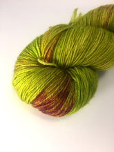 Hand Dyed Fingering Weight Superwash Merino cashmere nylon yarn in vibrant chartreuse with pink speckles