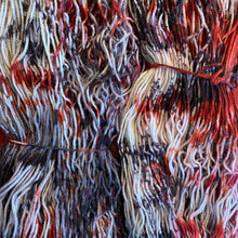 Hand Dyed Fingering Weight Superwash Merino cashmere nylon yarn in speckled red and black on white yarn