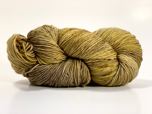 Hand Dyed Fingering Weight Superwash Merino cashmere nylon yarn in yellows golds and browns with flecks of red