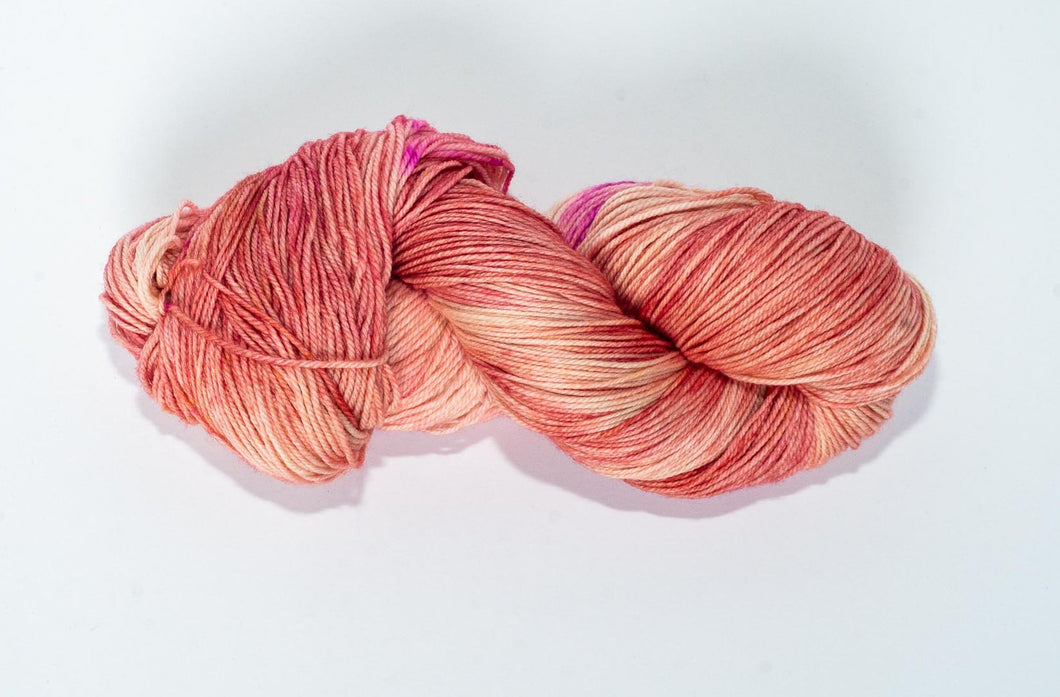 Hand Dyed Fingering Weight Superwash Merino cashmere nylon yarn in peachy pink