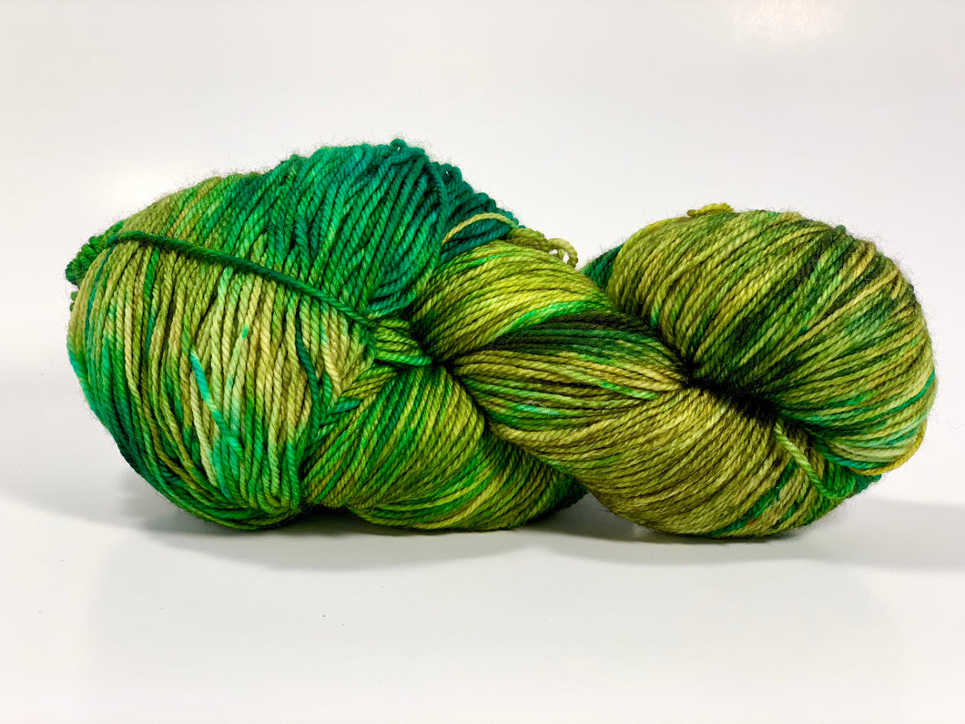 Hand Dyed Fingering Weight Superwash Merino cashmere nylon yarn in blue green yellow and brown